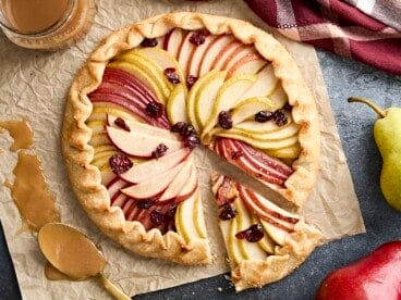 Overhead view of a pear galette with a slice cut out.