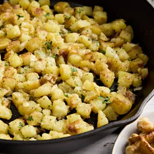 Side view close up of skillet breakfast potatoes.