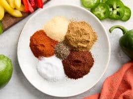 Ingredients for homemade fajita seasoning on a plate.