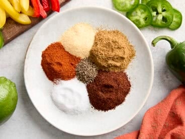 Ingredients for homemade fajita seasoning on a plate.