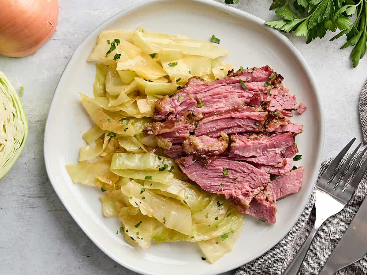 Overhead view of a plate of corned beef and cabbage.