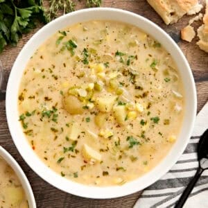Overhead view of a bowl of potato corn chowder.