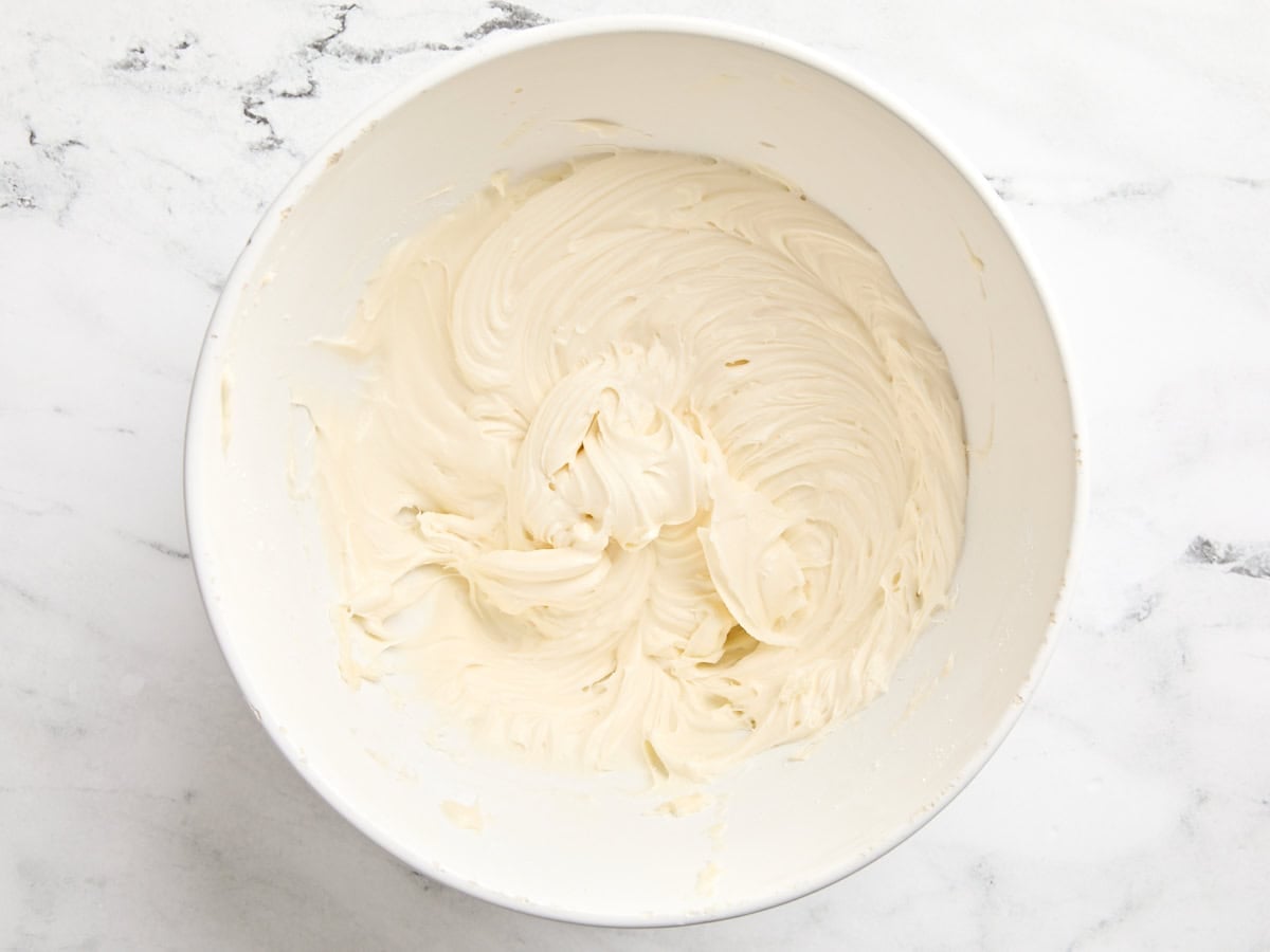 Cream cheese frosting in a mixing bowl.