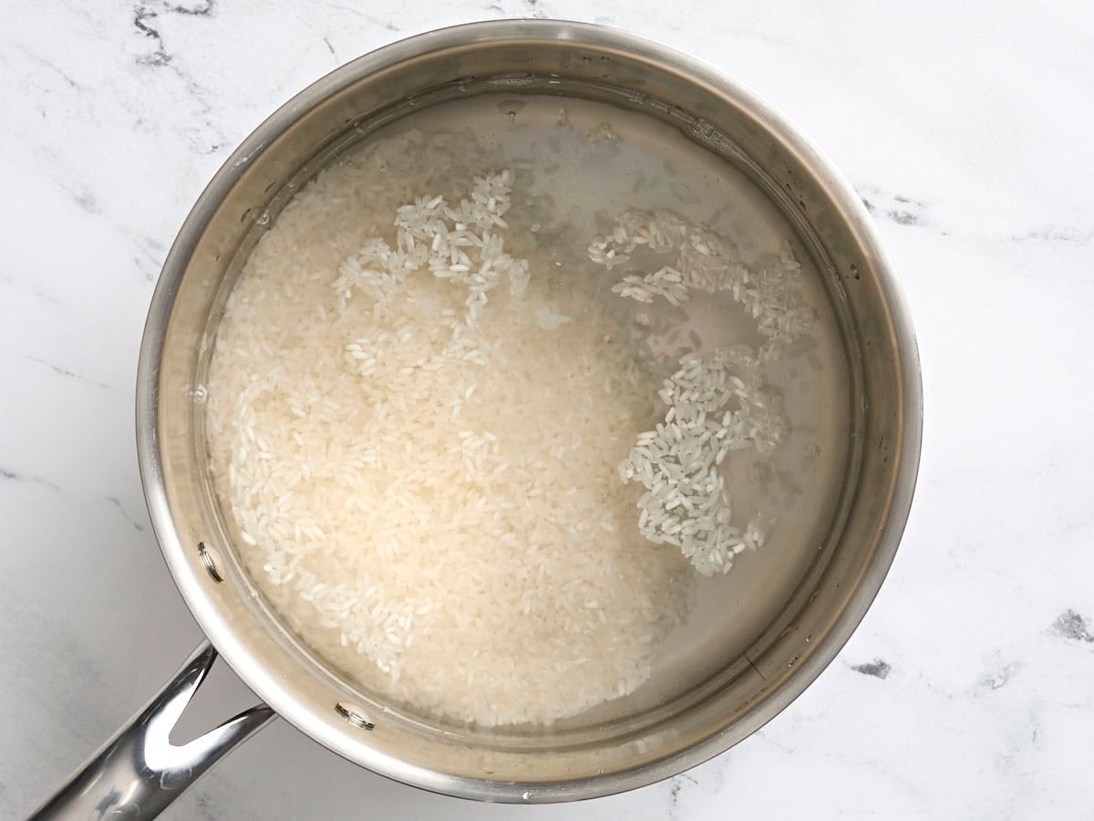 Rice cooking in a saucepan.