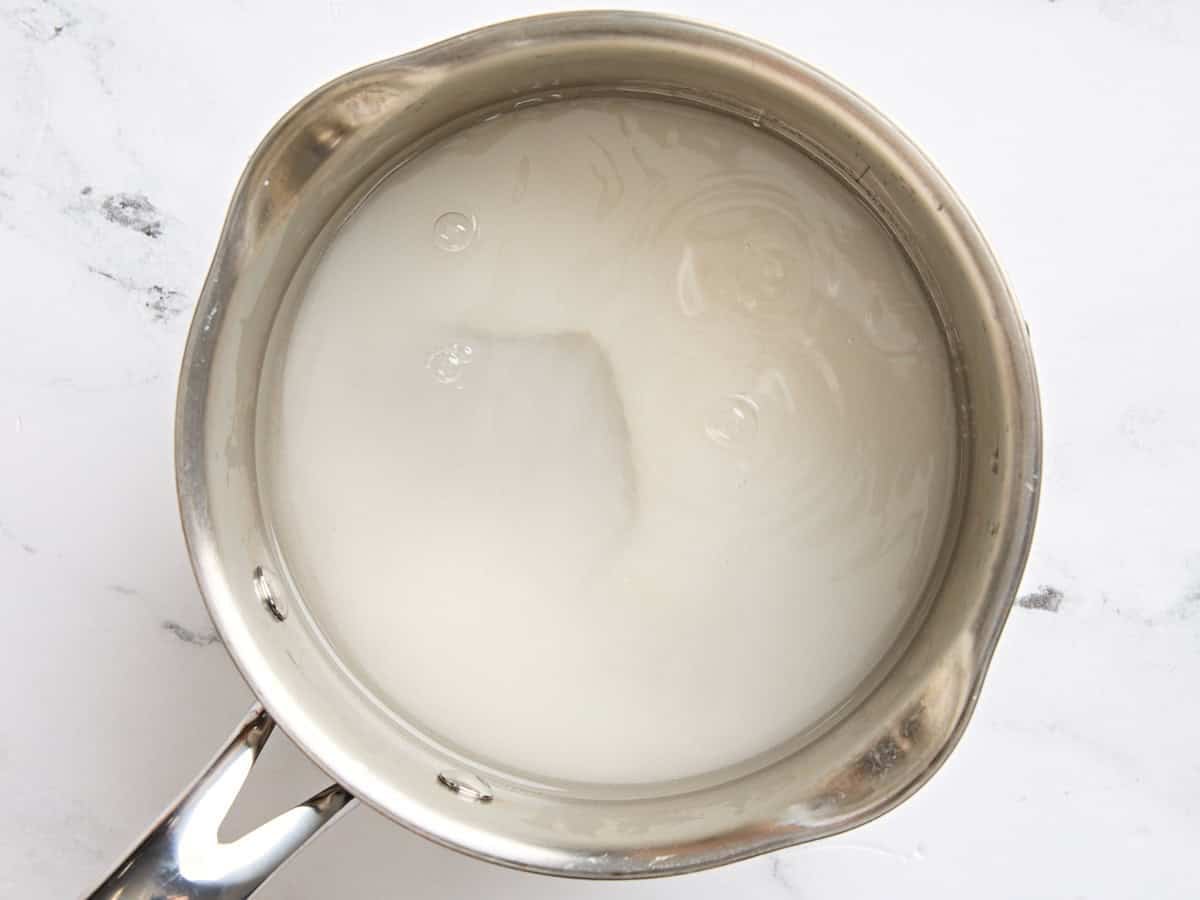 Sugar and water in a pot.