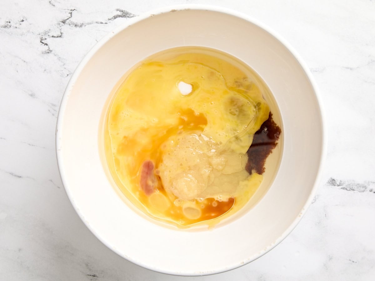 The wet ingredients for carrot cake in a bowl.