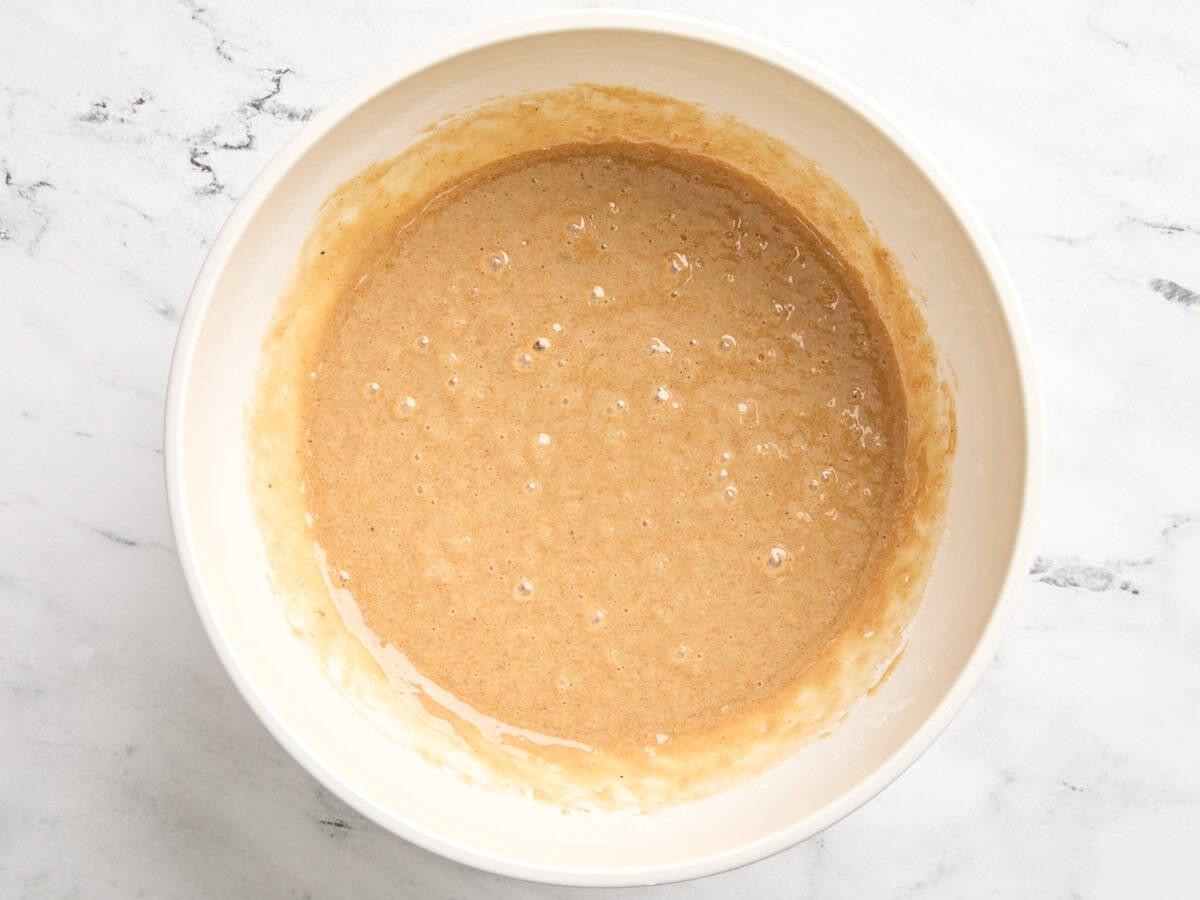 Homemade carrot cake batter in a mixing bowl.