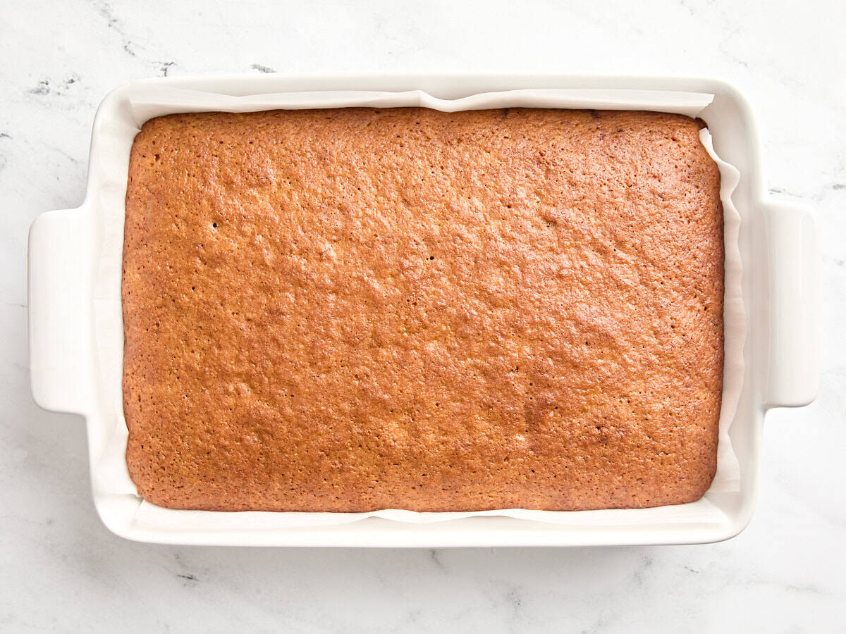 A freshly baked carrot cake in a baking dish.