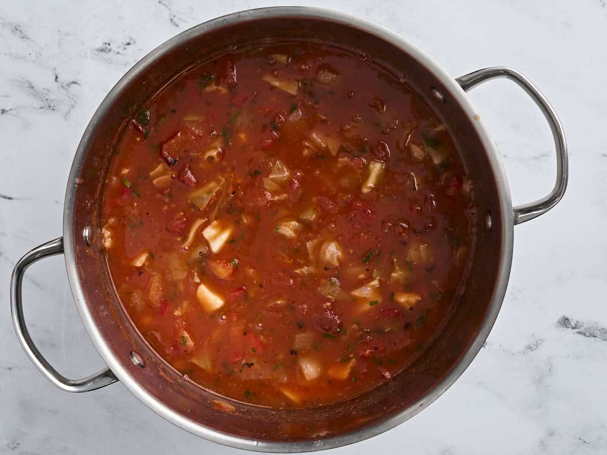 Finished homemade fish soup in a soup pot after simmering.