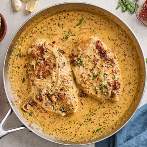 Overhead view of a marry me chicken recipe in a skillet.