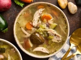 Overhead view of a bowl of homemade stone soup.