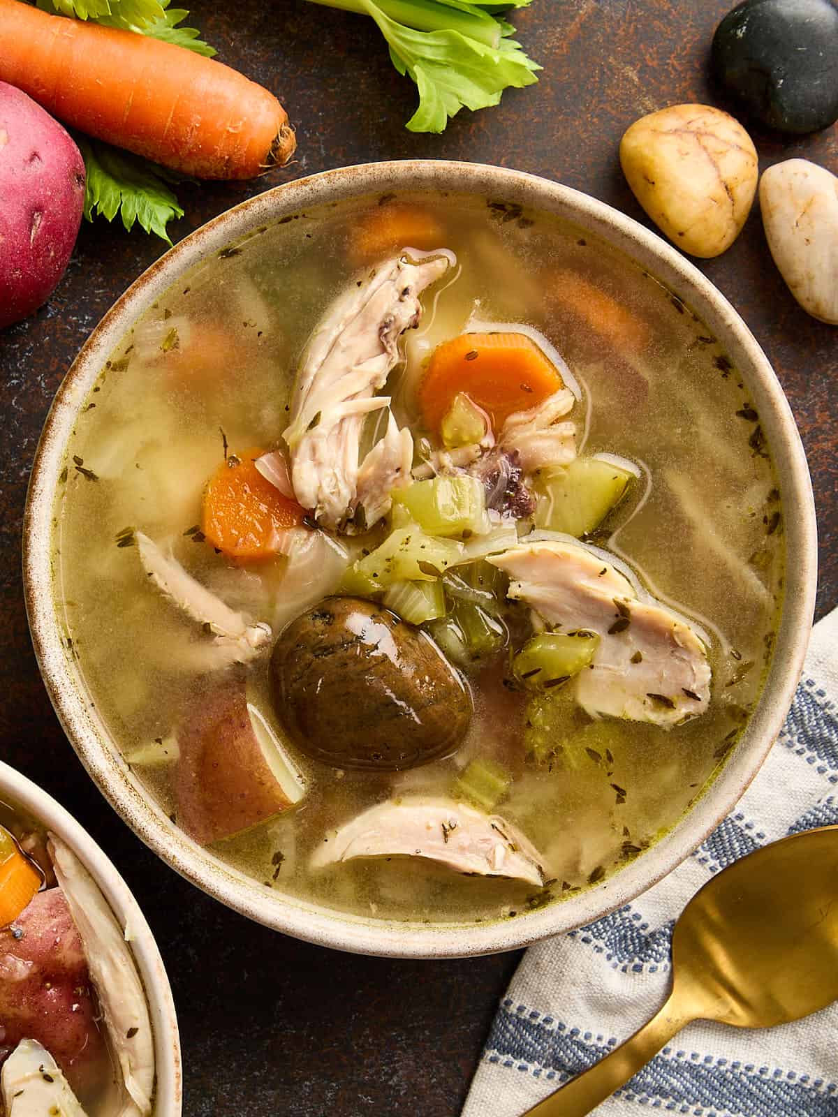Overhead view of a bowl of homemade stone soup.