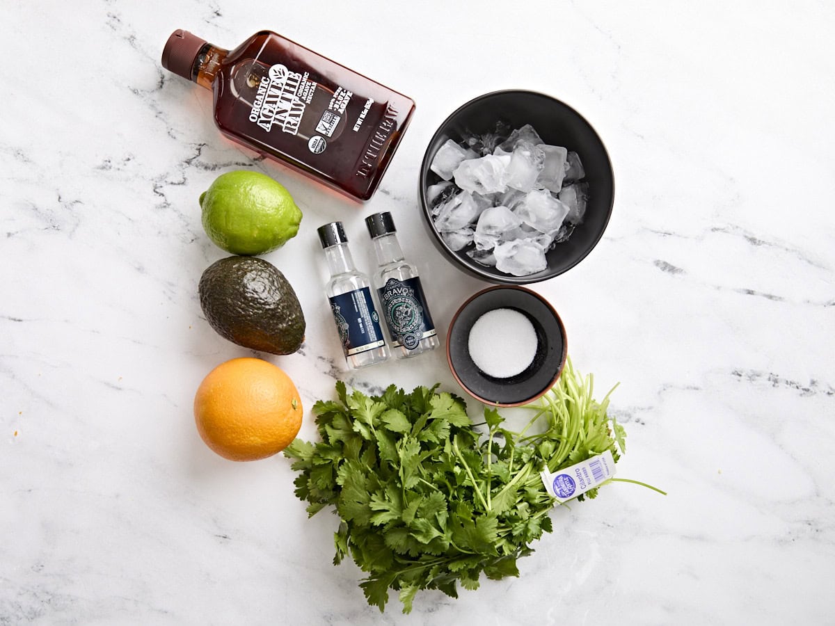 The ingredients to make two avocado margaritas.