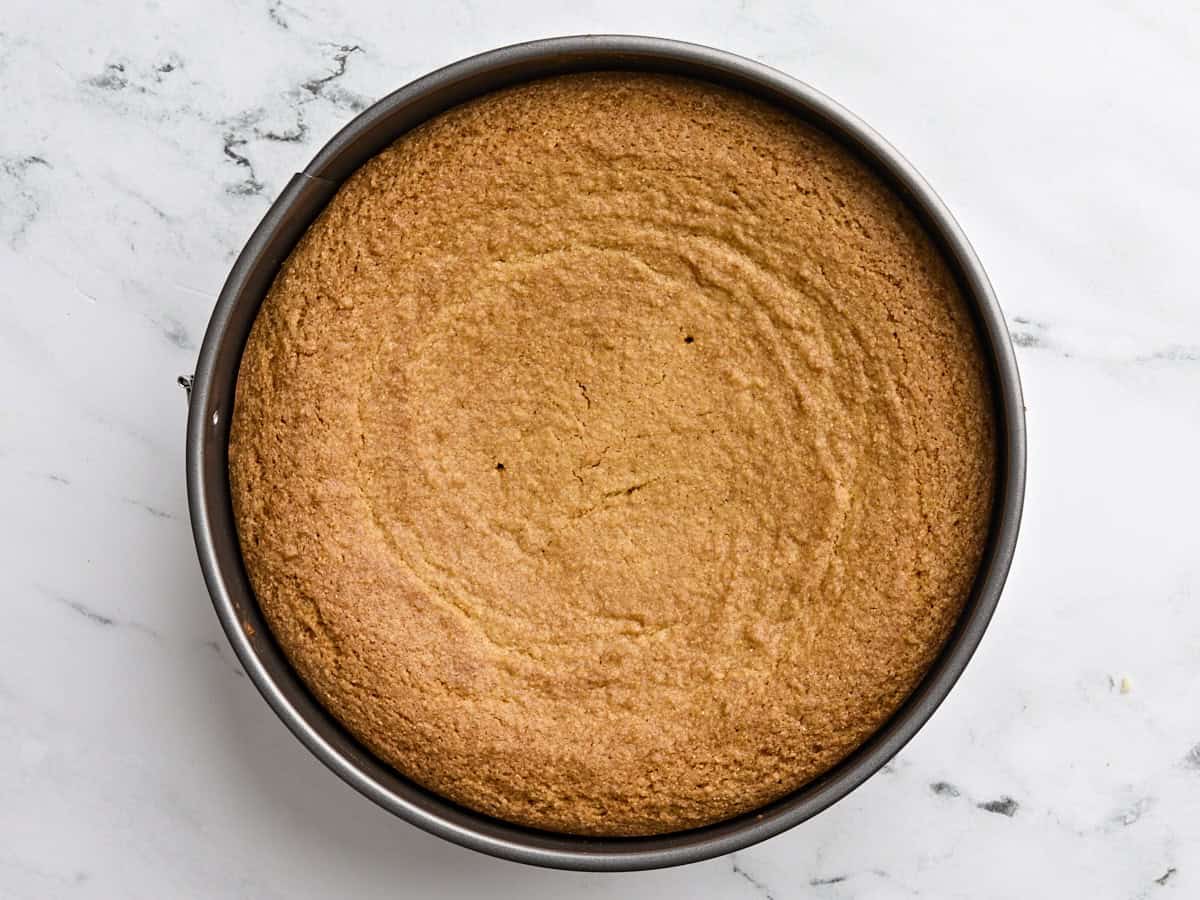 Freshly baked cornbread cake in a cake pan.