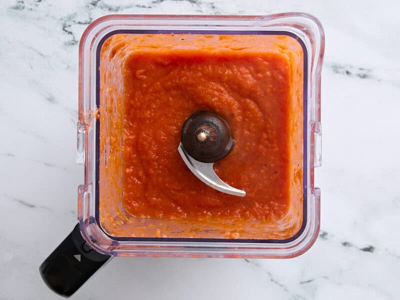 Spicy salsa in a blender after blending.