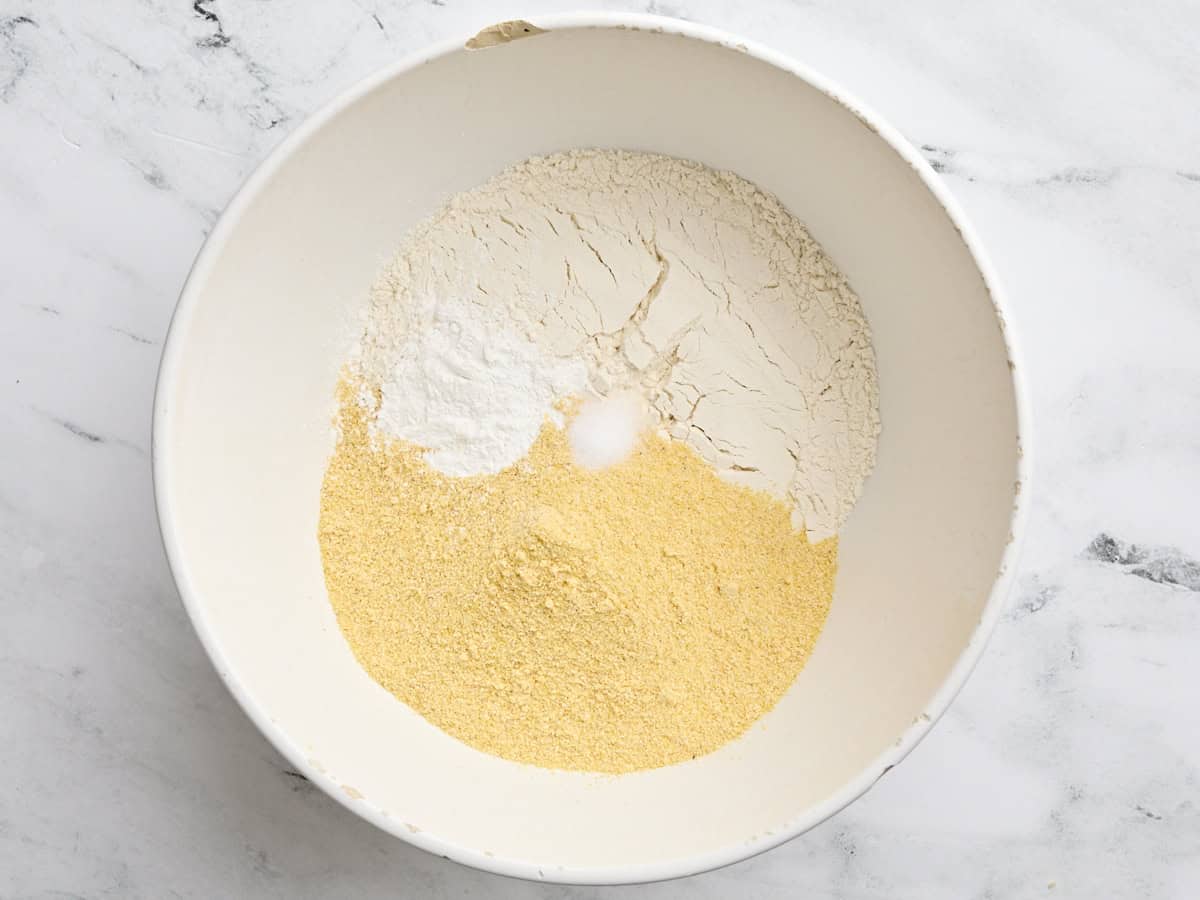 Flour, cornmeal, baking powder, and salt in a mixing bowl.