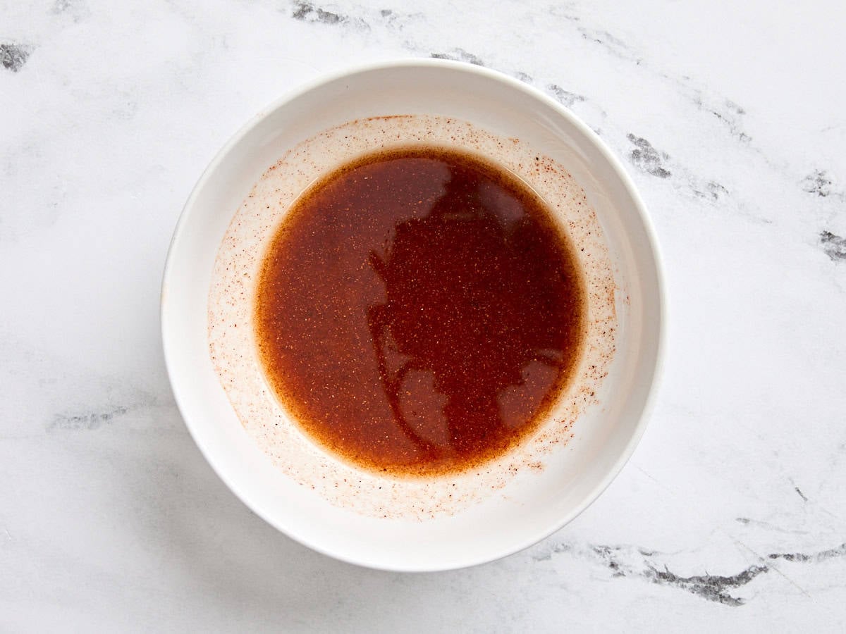 A homemade cauliflower steak marinade in a bowl.