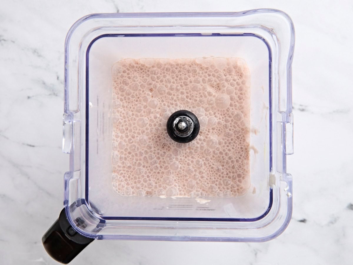 Chocolate milk, cool whip, and sweetened condensed milk in a blender.