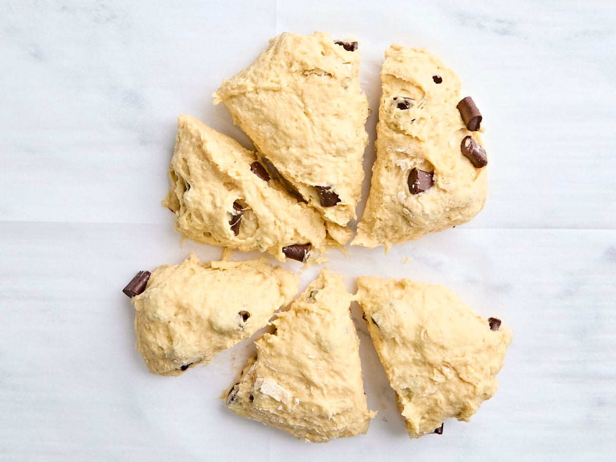 Sourdough chocolate chunk scone dough divided into 6 pieces.