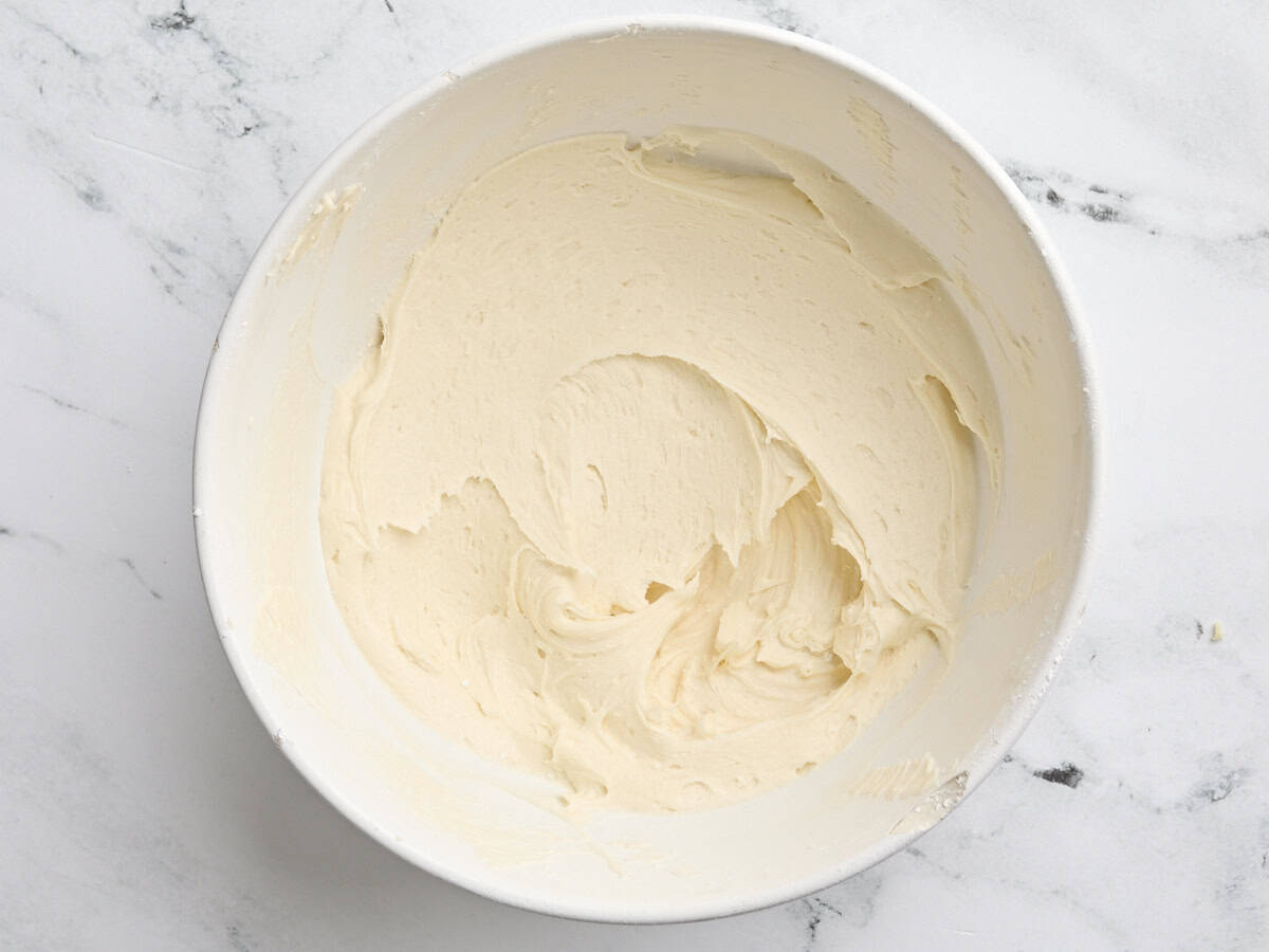 Homemade honey butter cream in a mixing bowl.