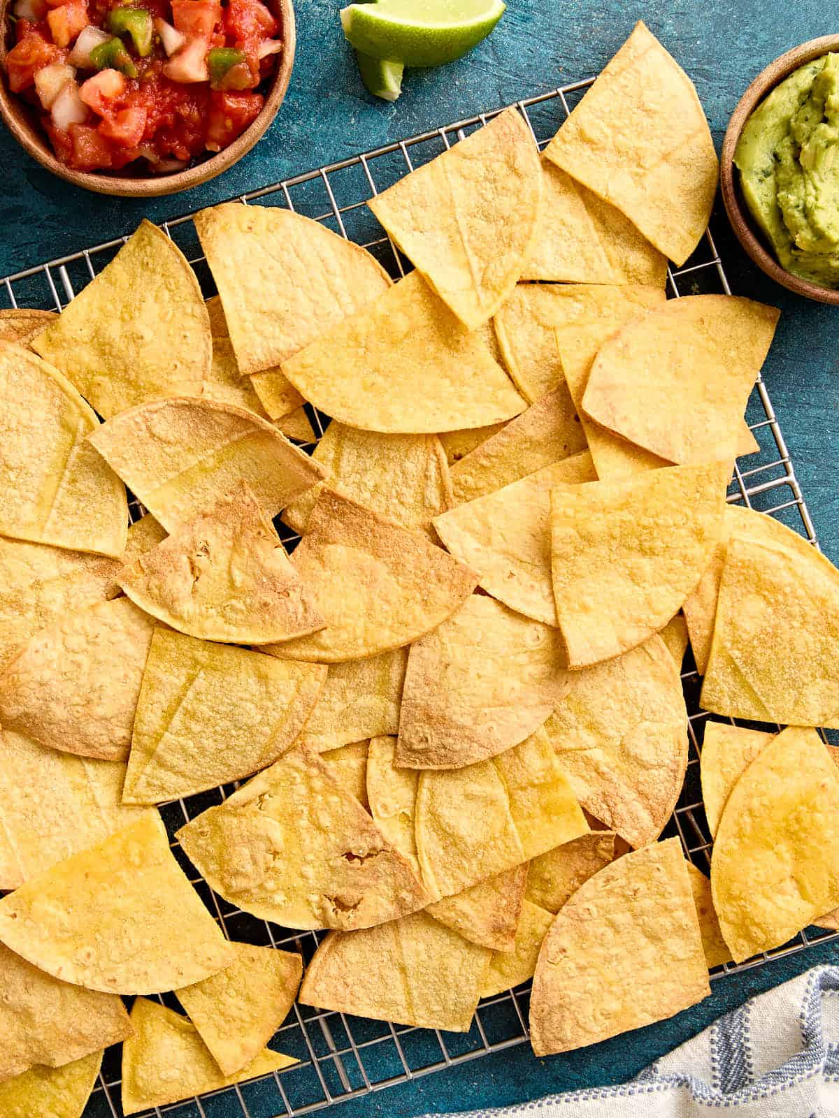 Overhead view of air fryer tortilla chips on a cooling rack.