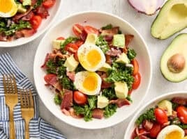 Overhead view of a blt avocado brunch salad bowl.