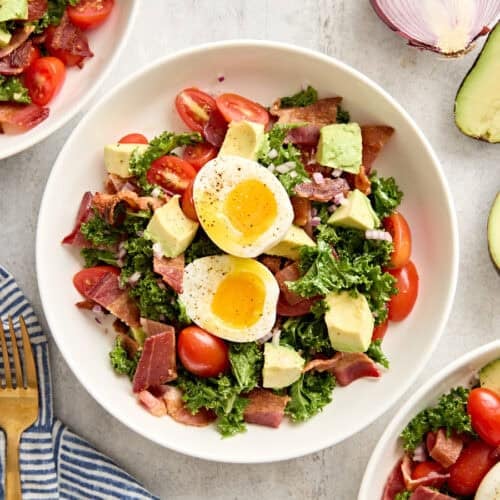 Overhead view of a blt avocado brunch salad bowl.