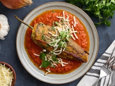 Overhead view of a chile relleno on a plate.