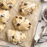 Overhead view of homemade chocolate chip sourdough scones on a parchment lined wire rack.