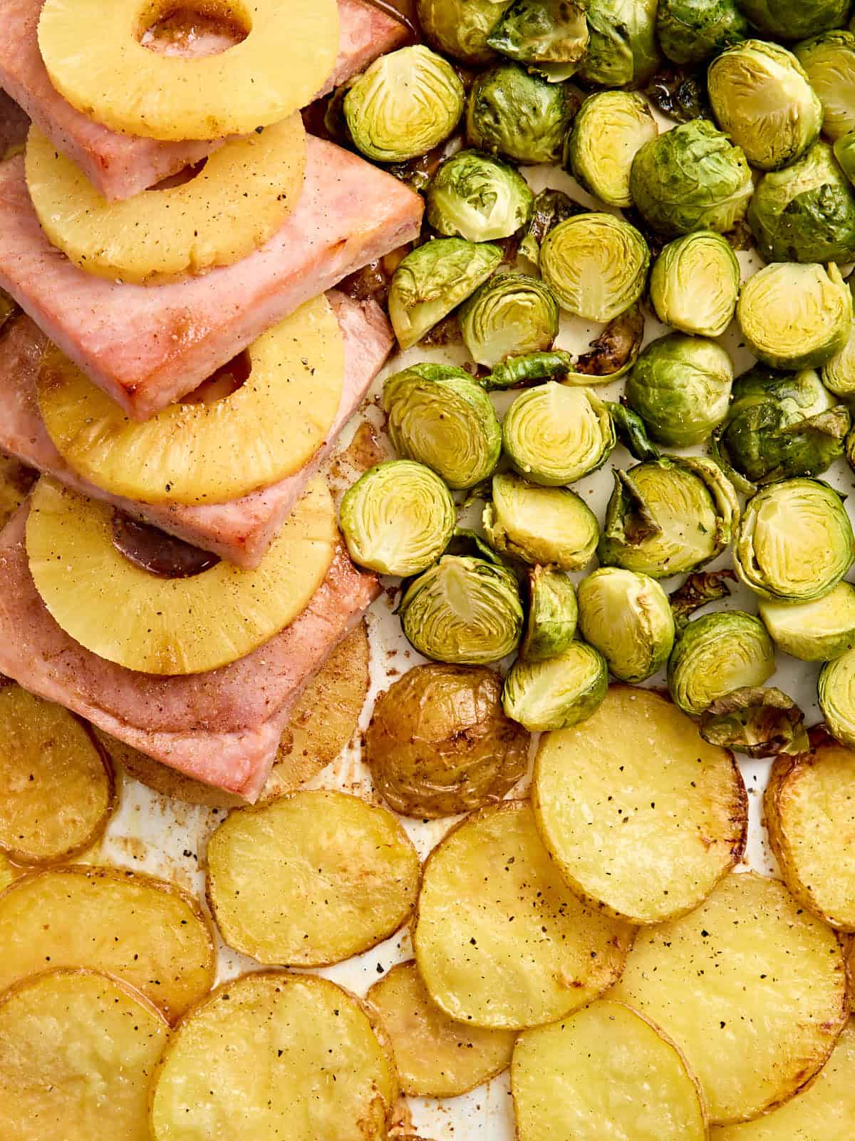 Overhead view of a sheet pan Easter dinner.