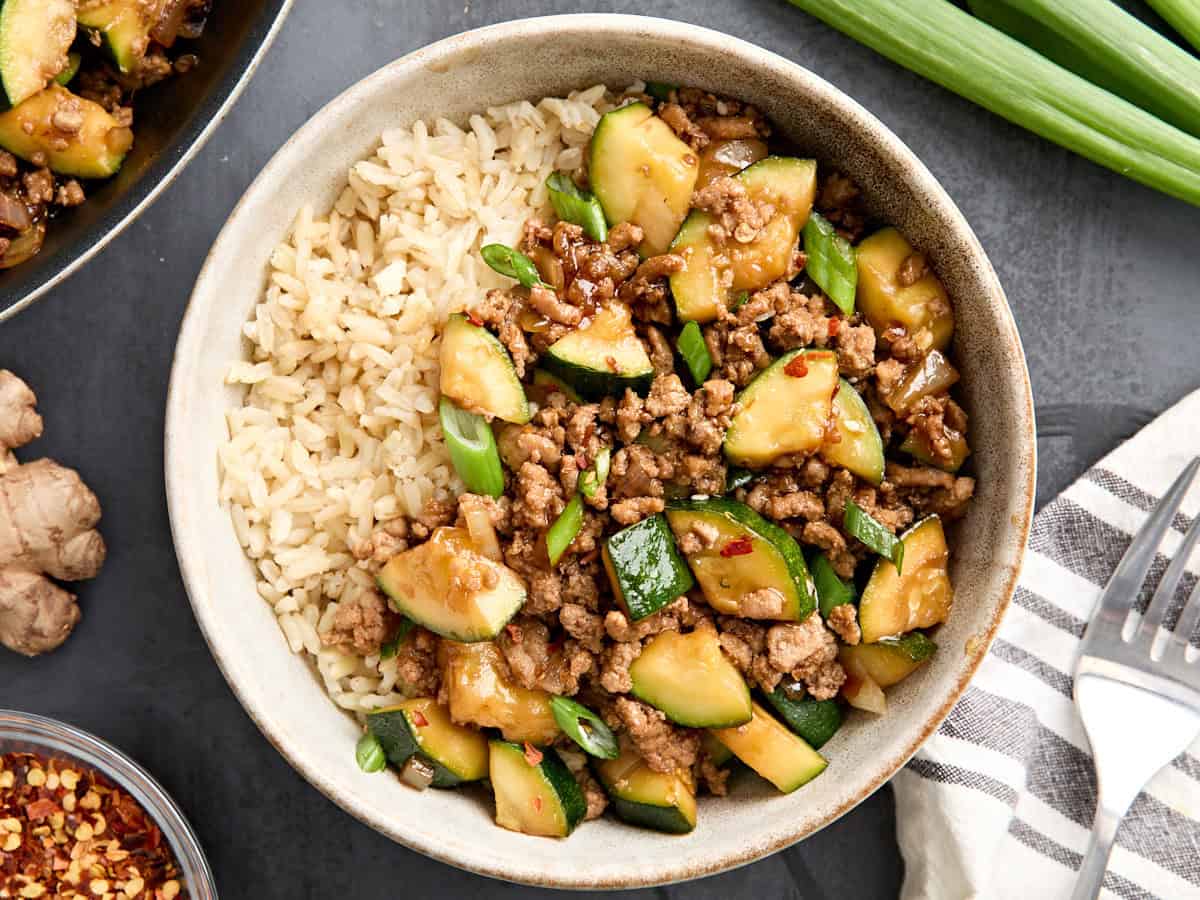 Overhead view of a bowl of ground turkey zucchini skillet dinner with rice.