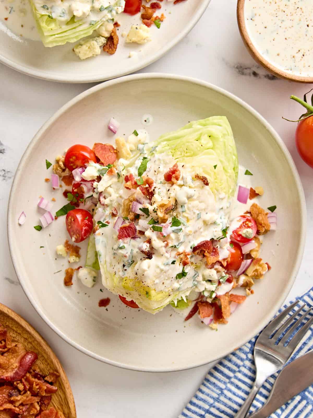 Overhead view of a wedge salad on a plate.