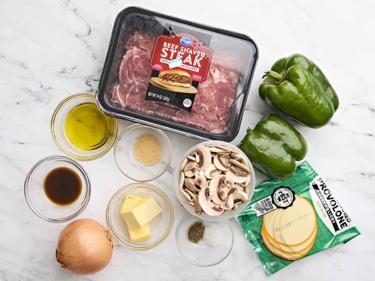 The ingredients to make philly cheesesteak stuffed peppers.