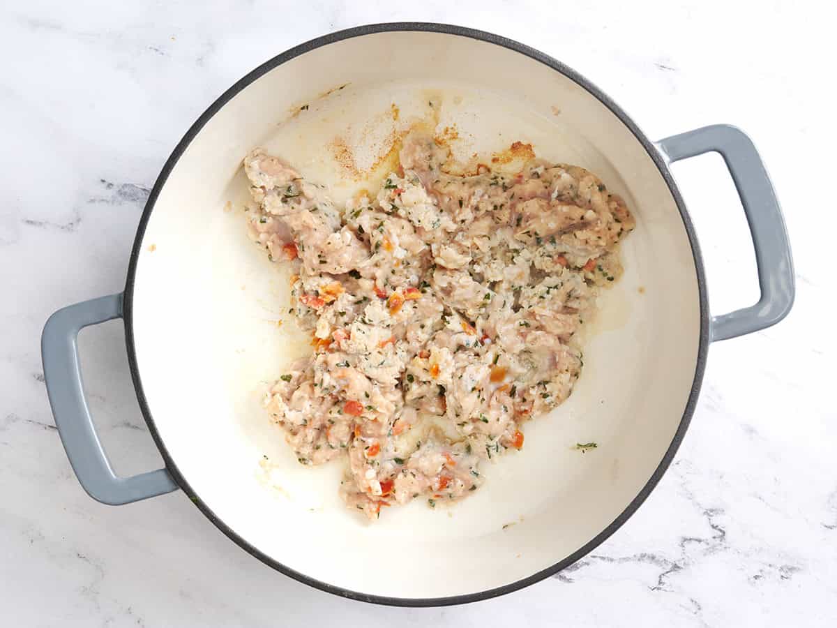 Seasoned ground chicken in a pot.