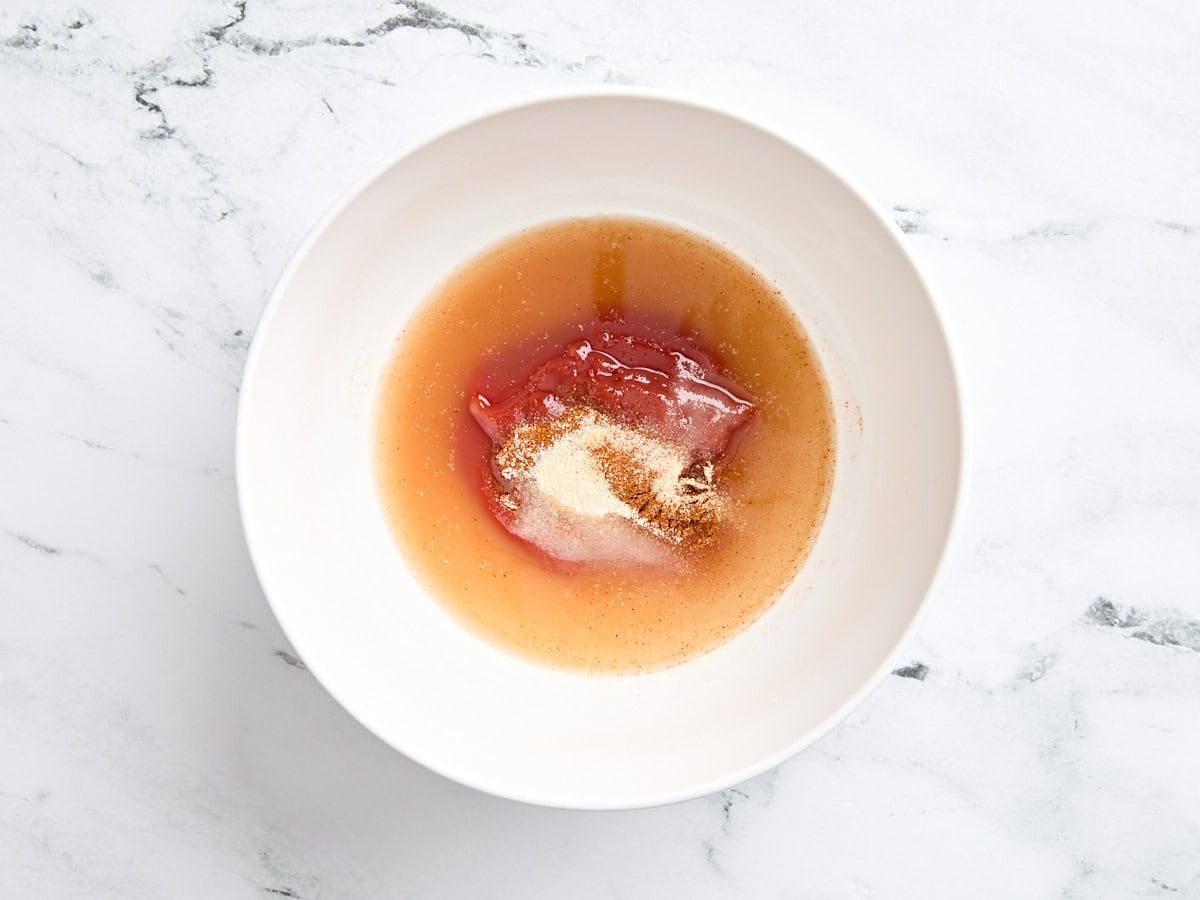 Ketchup, vinegar, sugar, paprika, garlic powder, onion powder, and salt in a bowl.