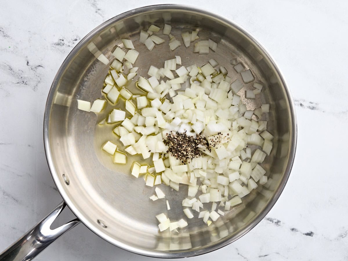 Diced onions and pepper in a saute pan.