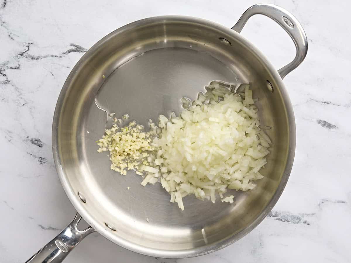 Diced onion and minced garlic in a saute pan.