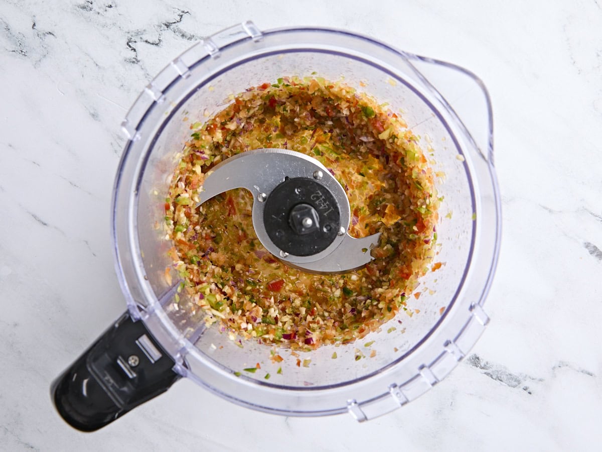 Processed vegetables in a food processor.