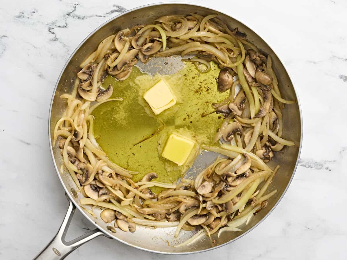 Butter added to sauteed onions and mushrooms.