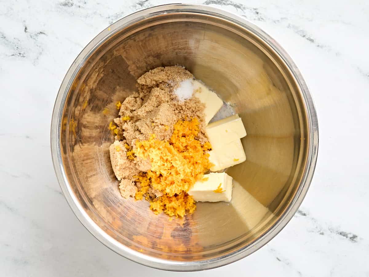 Brown sugar, orange zest, and butter in a mixing bowl.