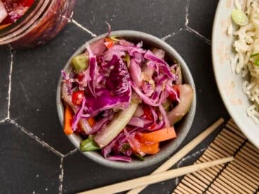 Overhead view of homemade kimchi in a bowl.