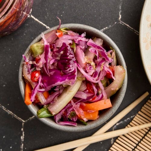 Overhead view of homemade kimchi in a bowl.