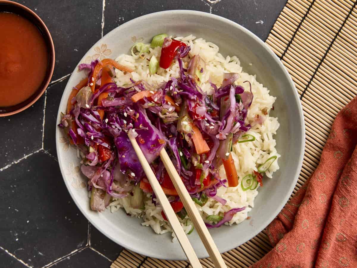 Overhead view of easy fermented vegetables on a bed of white rice.
