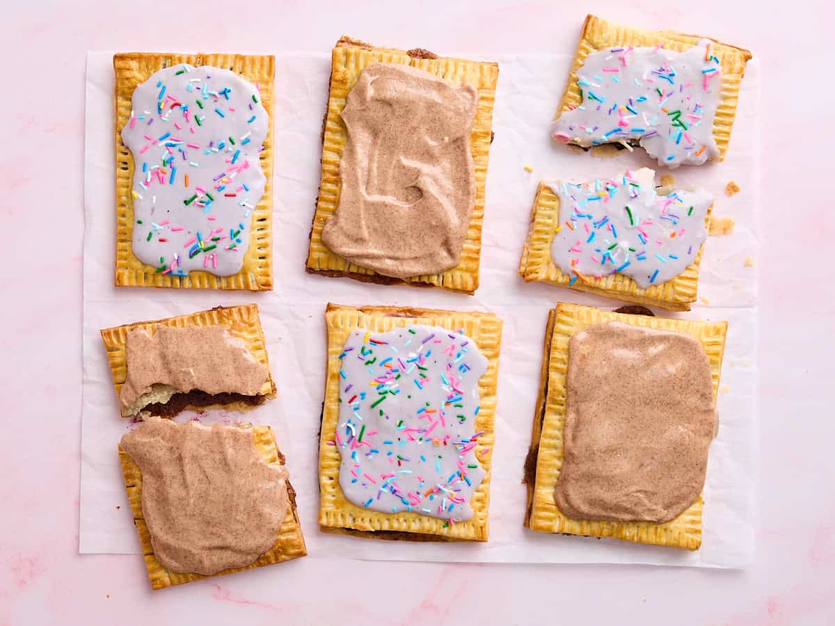 Overhead view of three blueberry and three brown sugar homemade pop tarts.