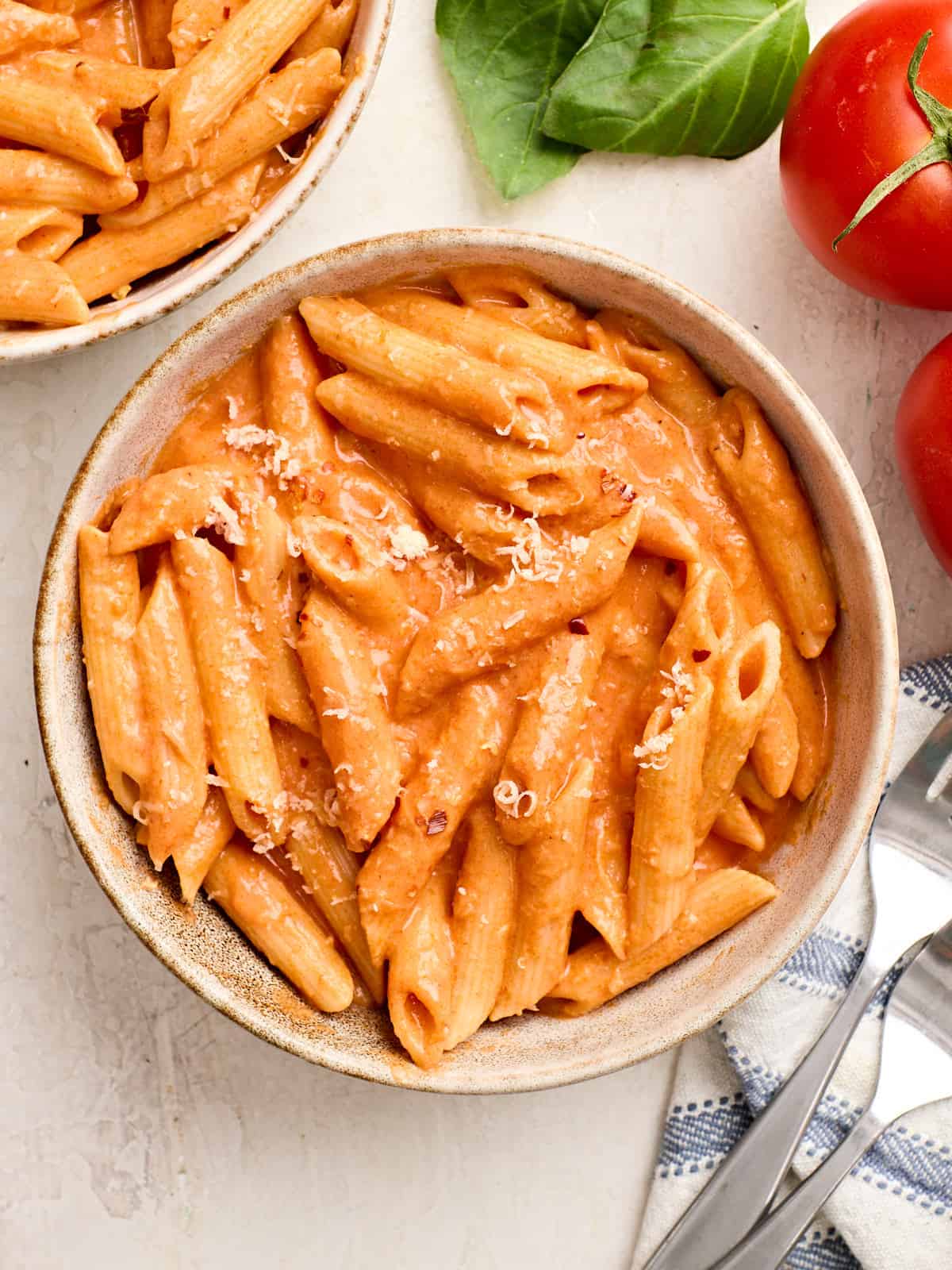 Overhead view of a bowl of pasta with homemade vodka sauce.