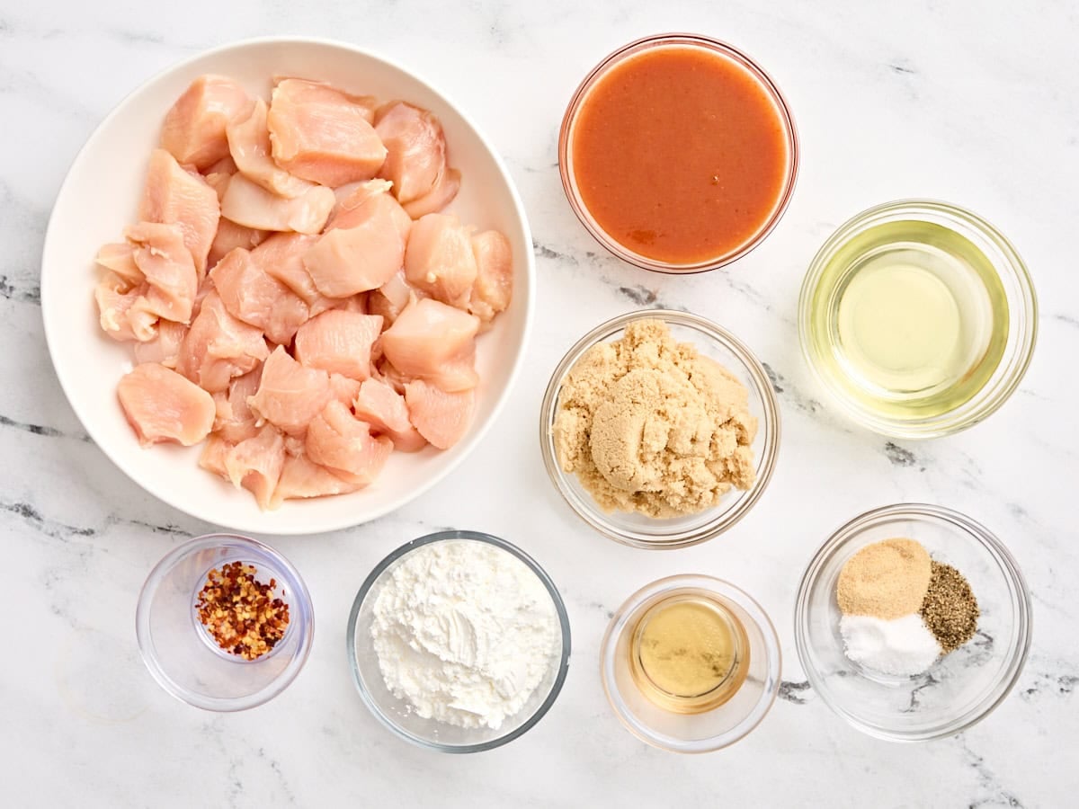 The ingredients to make homemade firecracker chicken in a skillet.