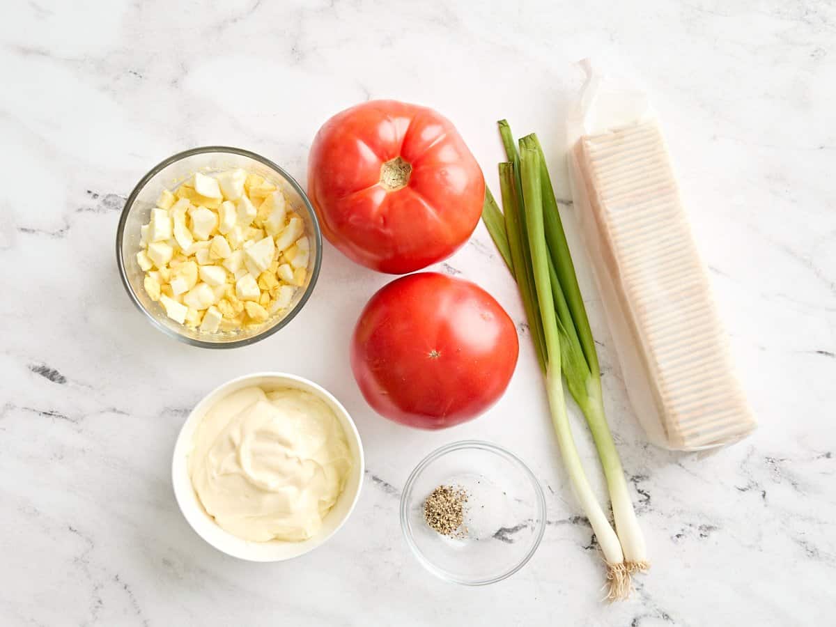 The ingredients to make a Southern tomato cracker salad.