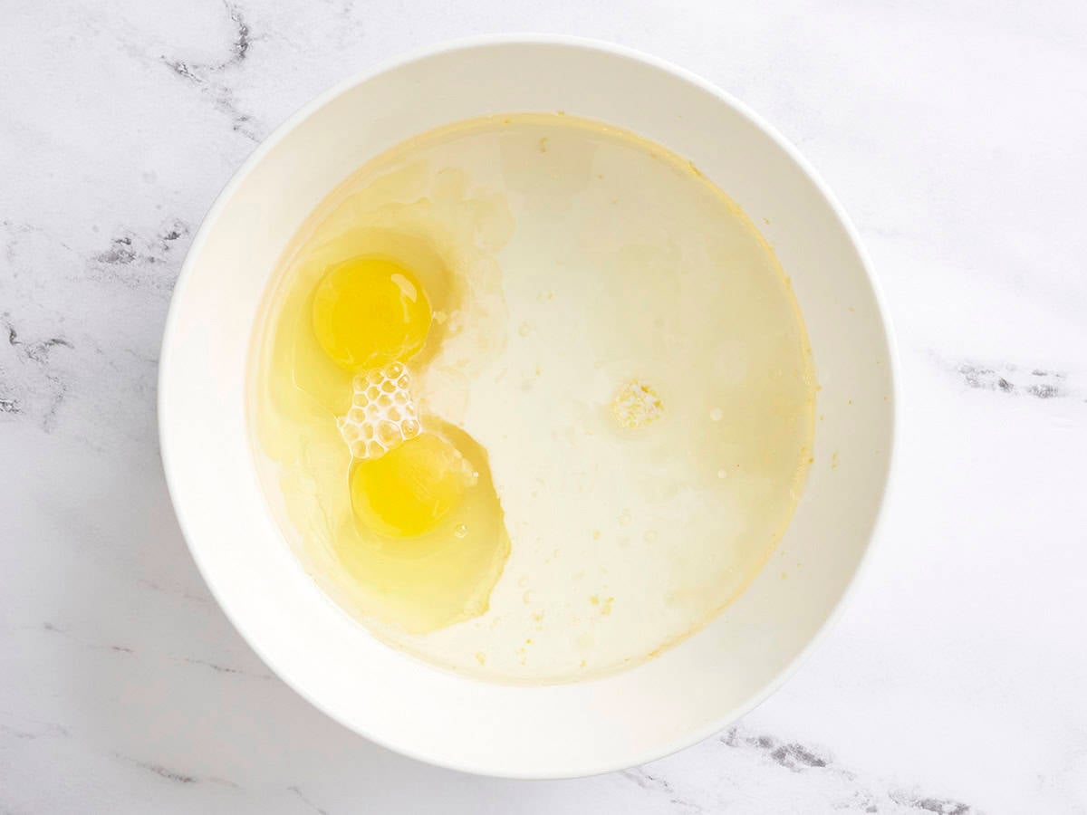 Eggs and milk in a mixing bowl.