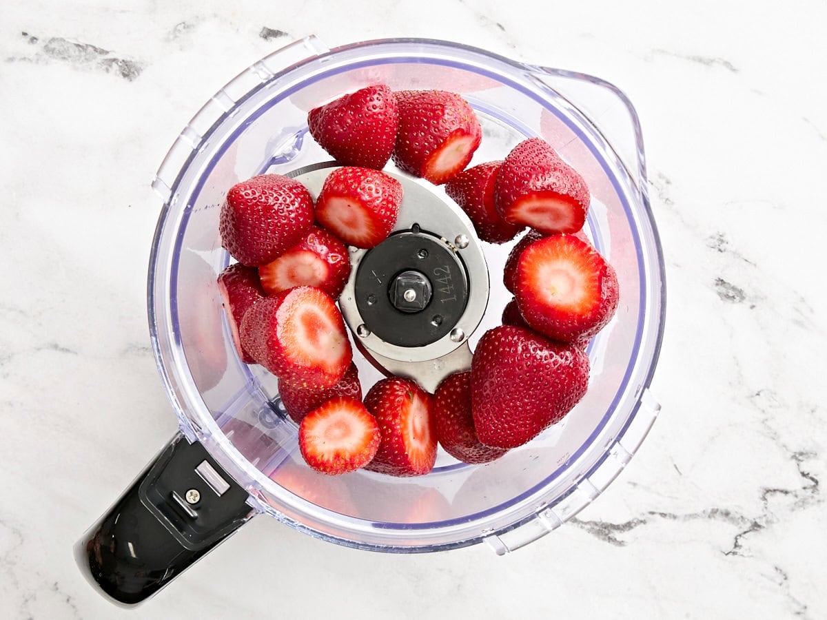 Fresh strawberries in a food processor.