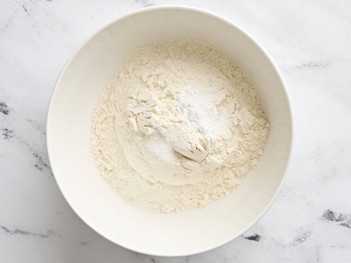 Flour, baking powder, and salt in a mixing bowl.